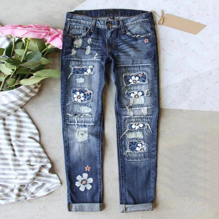 High-Waisted Blue Floral Print Stretch Jeans with Ripped Details